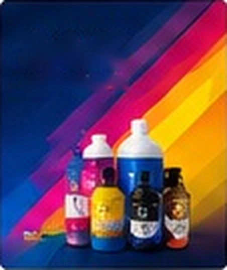 Botol tinta SpinK cyan, magenta, kuning, dan hitam dengan latar warna-warni